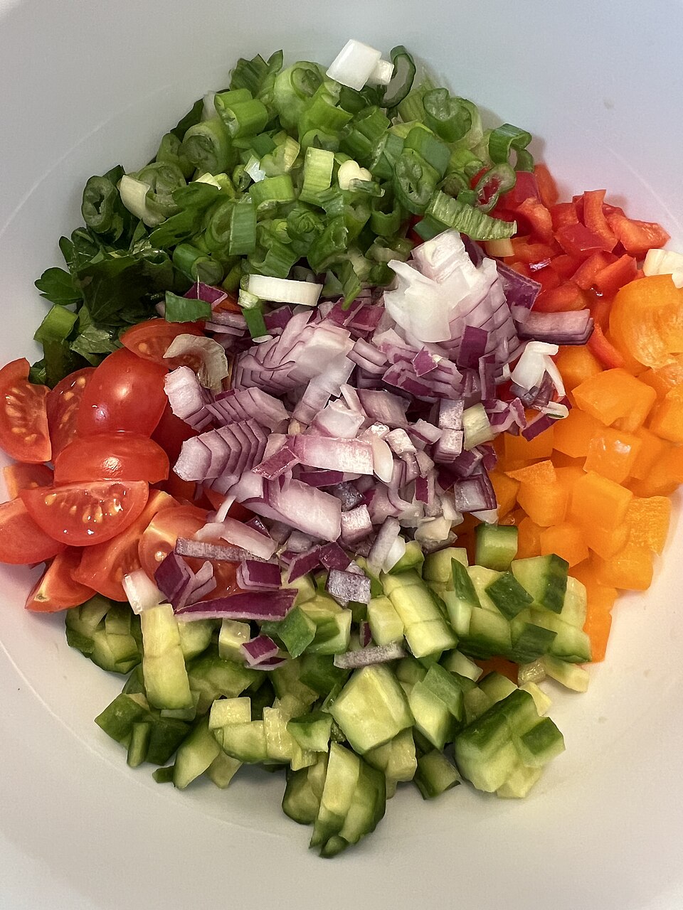 A bowl of Greek angourodomata cucumber and tomato salad
