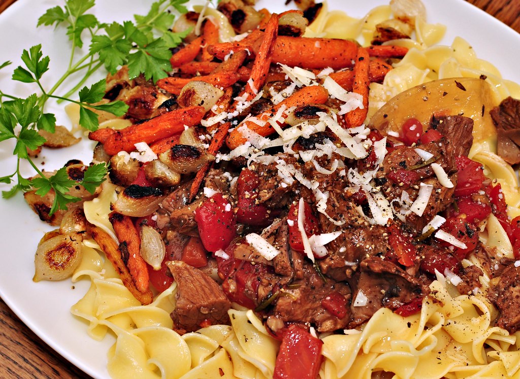 A pot of Greek arni kokkinisto lamb braised in red tomato sauce