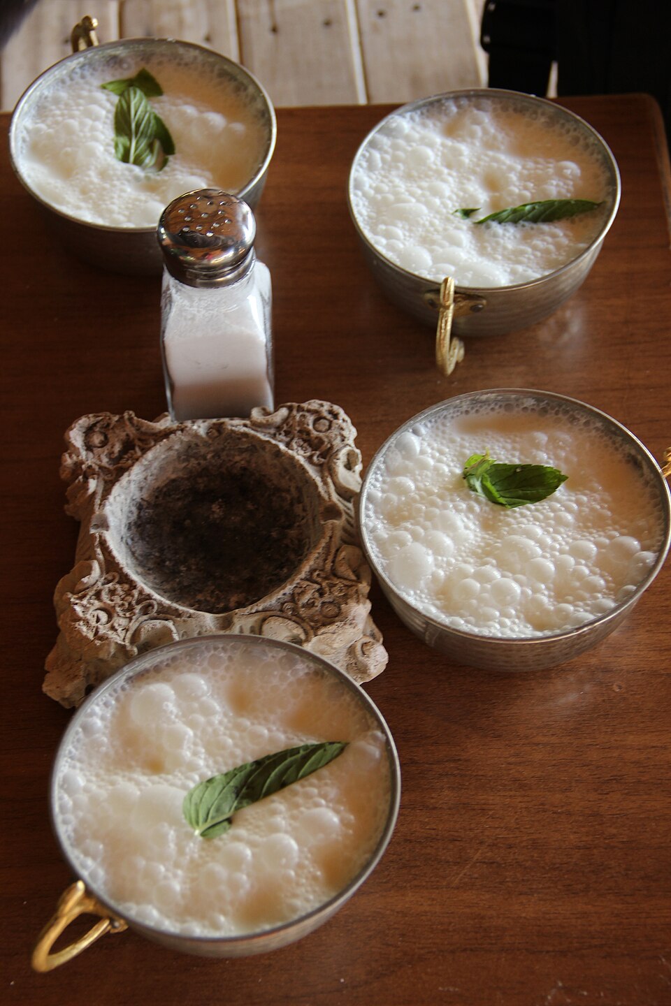 A glass of Cypriot ayrani, cold salted yogurt drink with mint