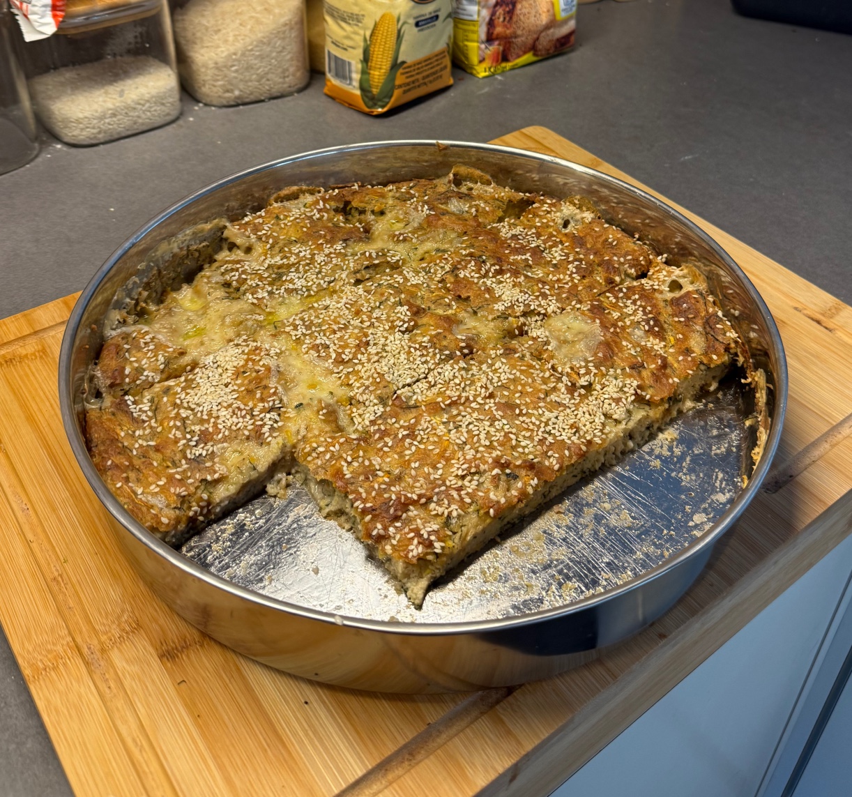 A rustic loaf of Epirus batzina cornbread with greens
