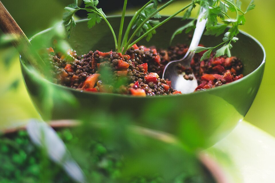 A bowl of Greek fakes salata lentil salad with red onion and parsley