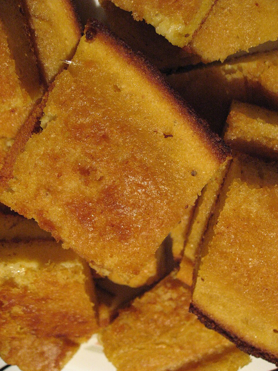 Golden Greek frigania fried bread slices drizzled with honey
