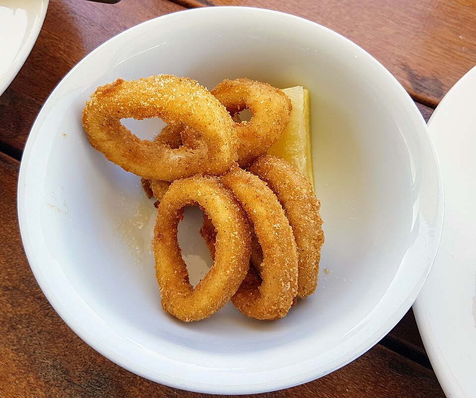 Golden Greek fried baby squid rings with lemon