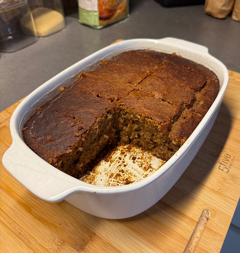 A slice of Greek karydopita walnut syrup cake on a plate