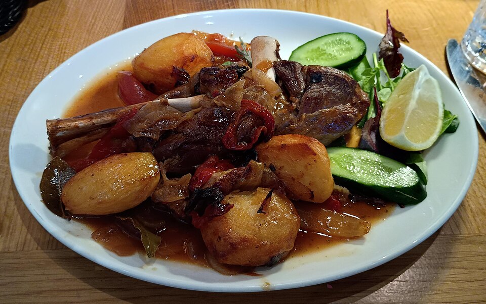 Slow-cooked Greek lamb kleftiko falling off the bone with potatoes and lemon