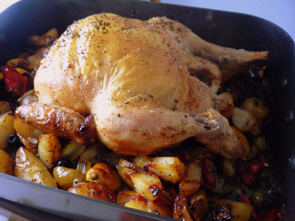 A tray of Greek lemon chicken and potatoes roasted golden