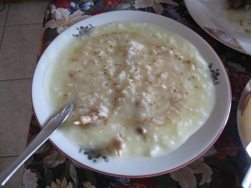 A bowl of Greek kotosoupa avgolemono chicken and rice soup