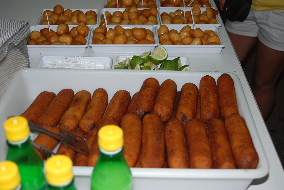 Golden fried Cypriot koupes bulgur shells on a plate with lemon