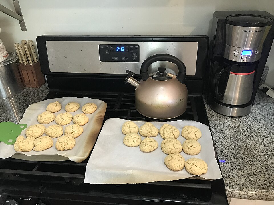 A plate of Greek ladokouloura olive oil cookies dusted with sugar