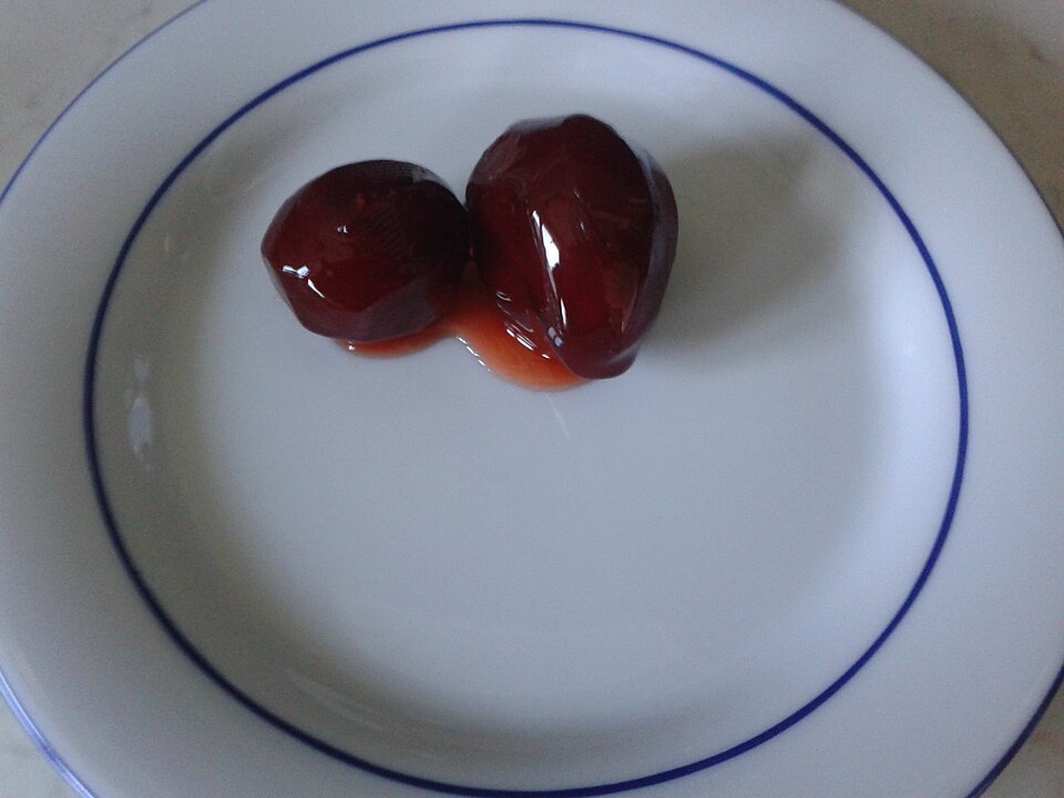 A jar of Greek melitzanaki glyko candied baby aubergine spoon sweet