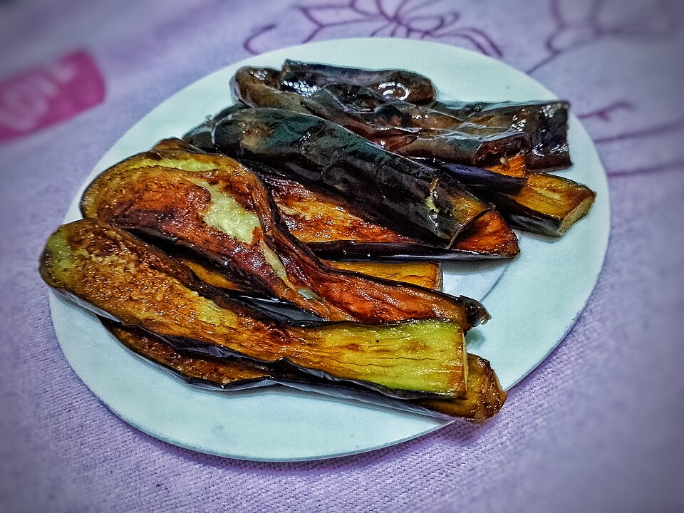 Golden fried Greek aubergine slices with tzatziki
