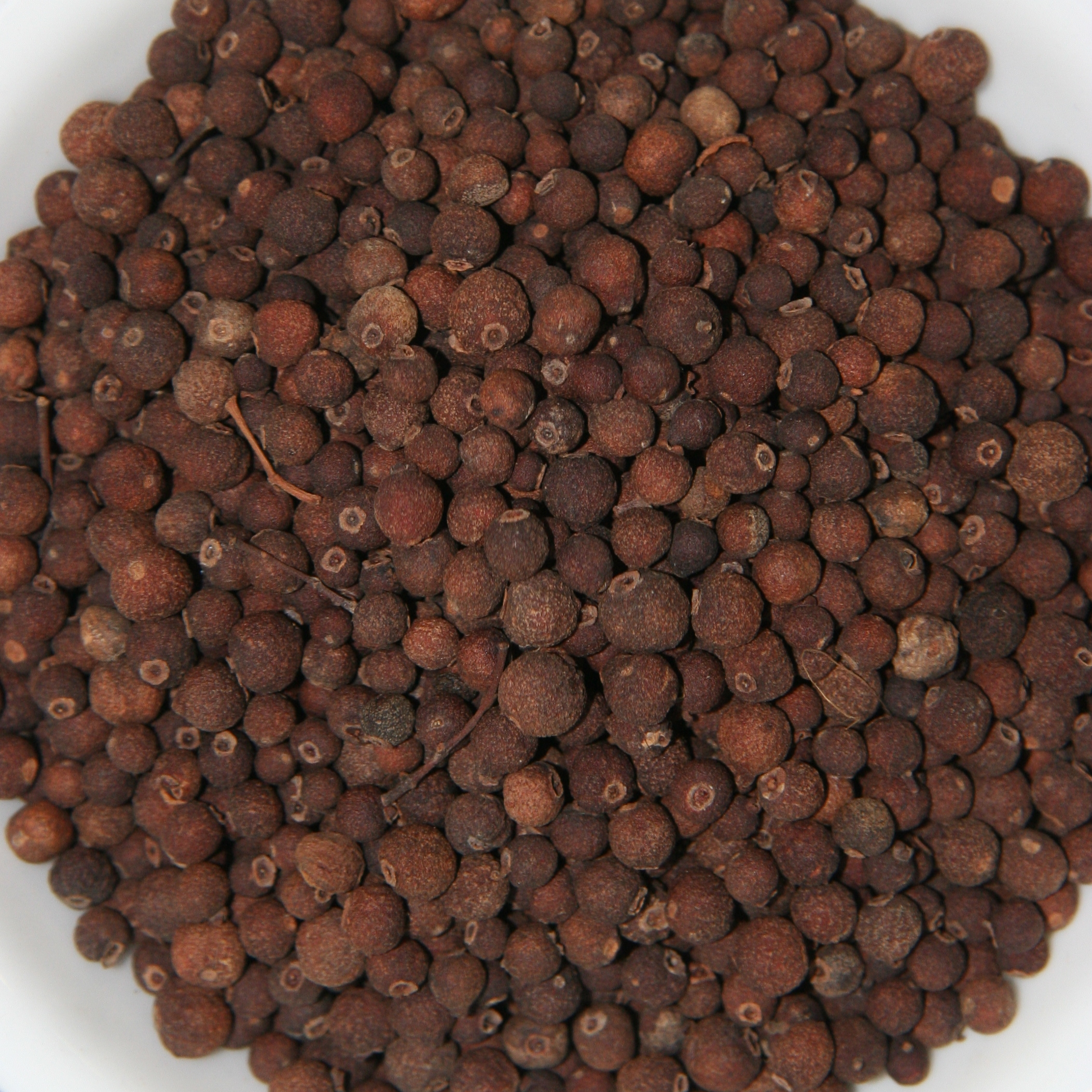 Whole allspice berries, used in Greek mince dishes and braises