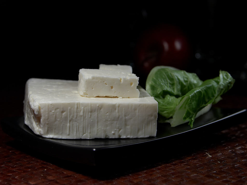 A block of Greek feta cheese in brine