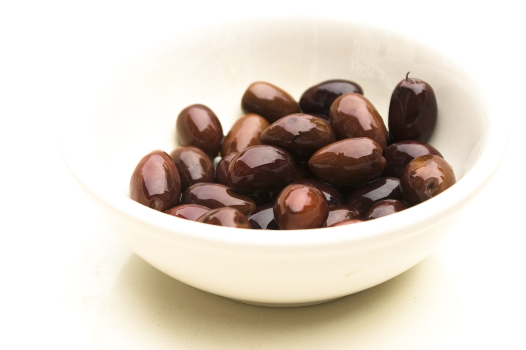 Kalamata and cracked green olives, cured for the table