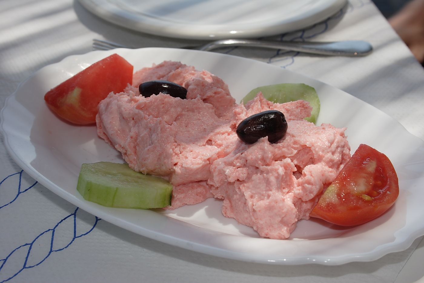 A jar of pale cured fish roe, taramas, for taramosalata
