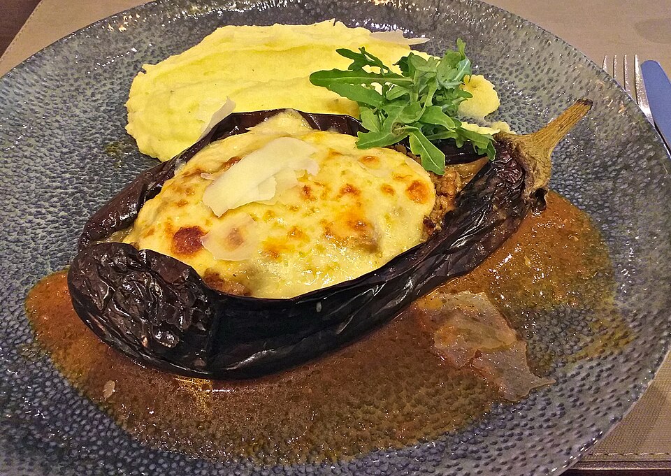 Greek papoutsakia stuffed aubergine boats topped with golden bechamel