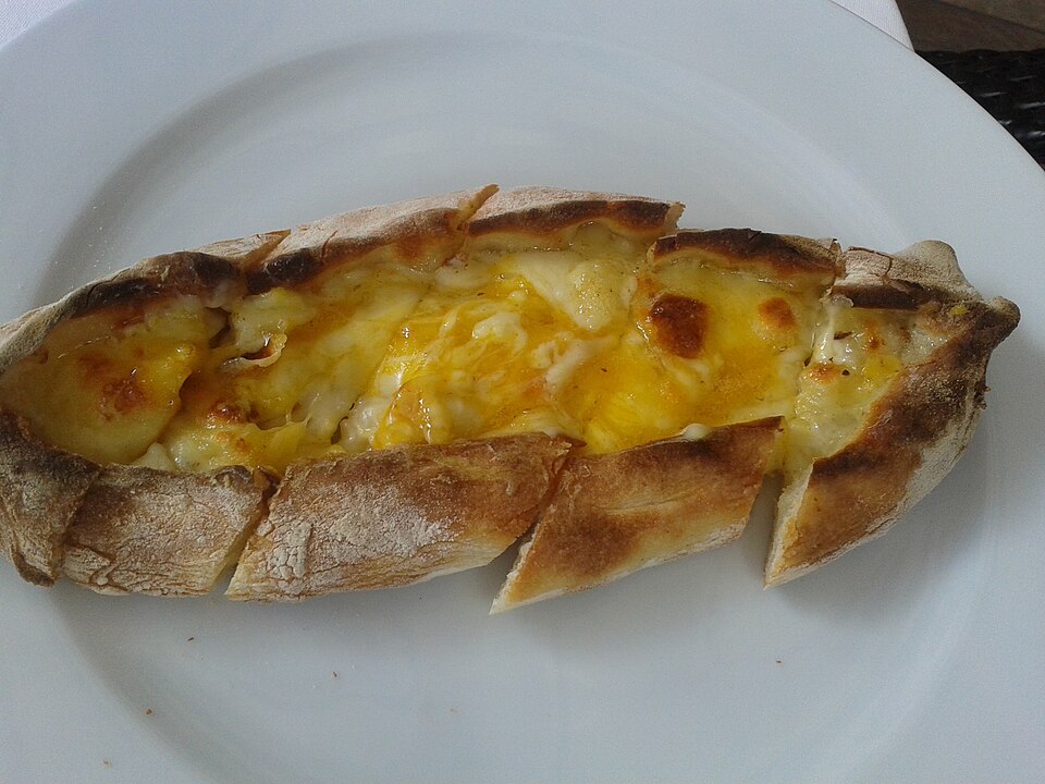A Pontic Greek peinirli boat-shaped cheese bread fresh from the oven