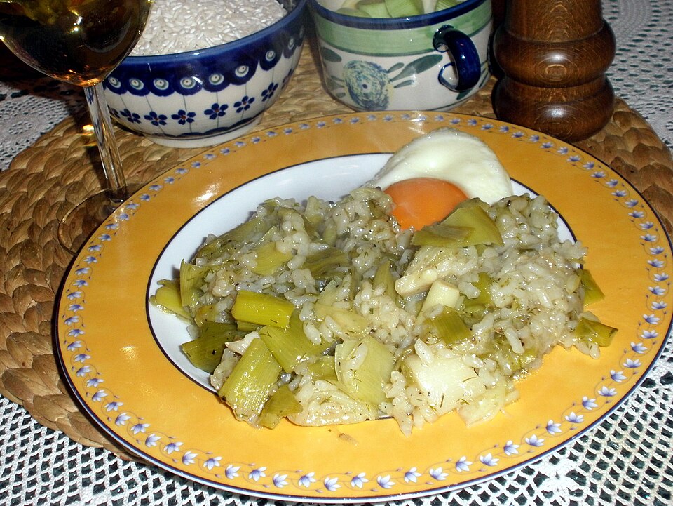 A pot of Greek prasorizo leek and rice, pale and glossy with olive oil