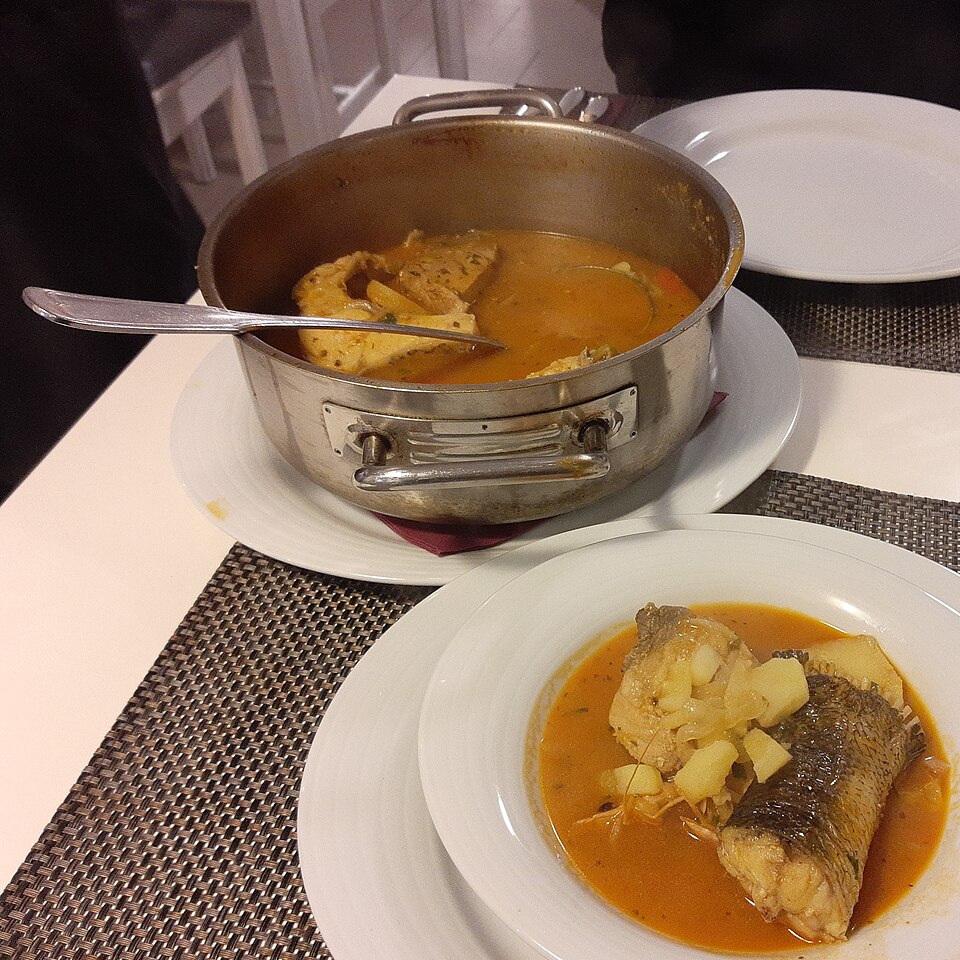 A bowl of Greek psarosoupa fish soup with avgolemono
