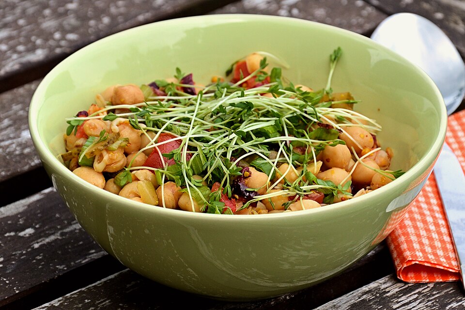 A bowl of Greek revithosalata chickpea salad with red onion and parsley