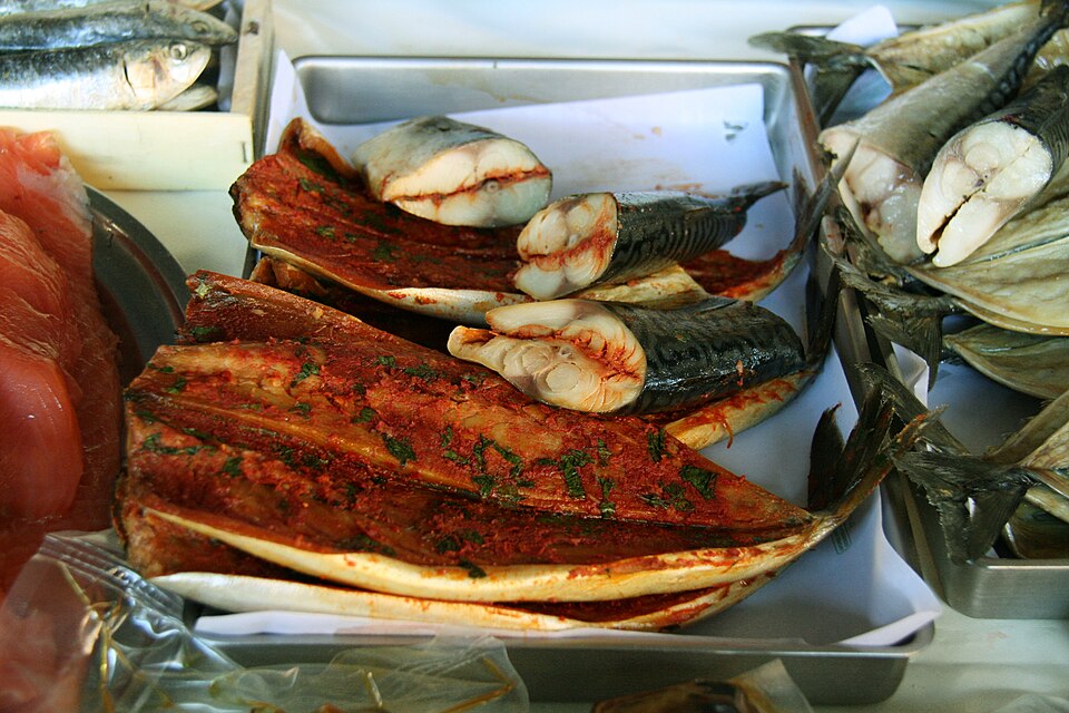 A dish of Corfiot savoro, fried fish under vinegar, rosemary and currants