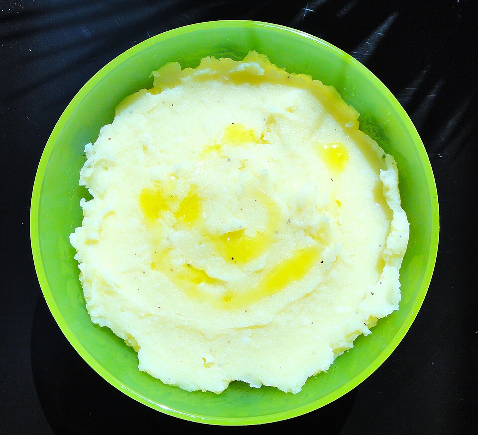 A bowl of Greek skordalia garlic potato dip drizzled with olive oil
