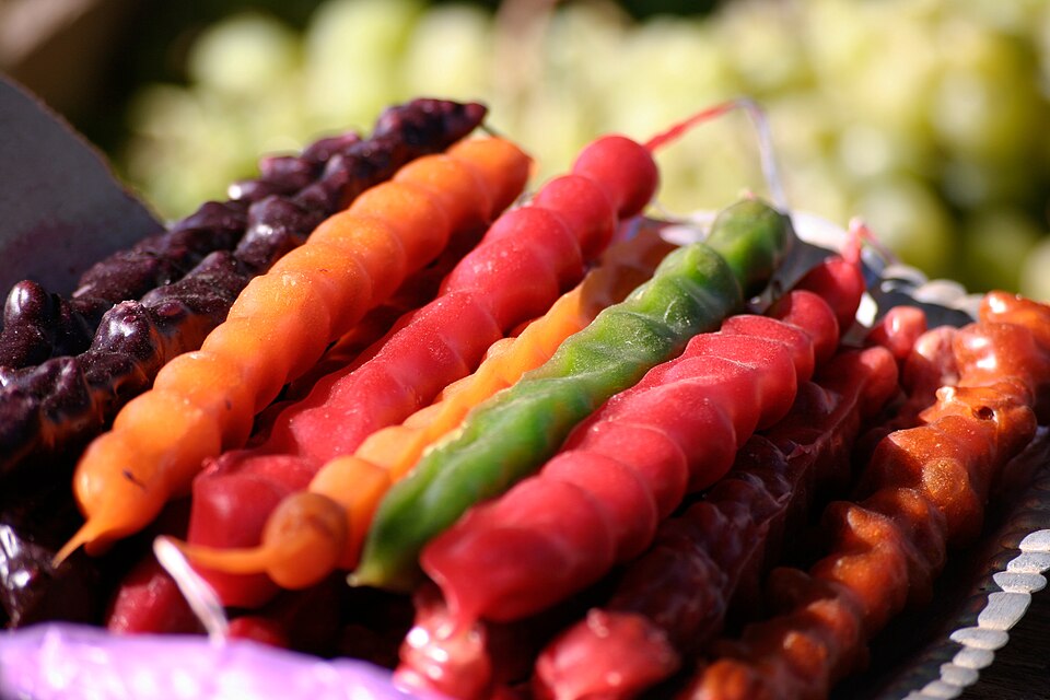 Strings of Greek soutzouki walnut and grape must candy hanging to set