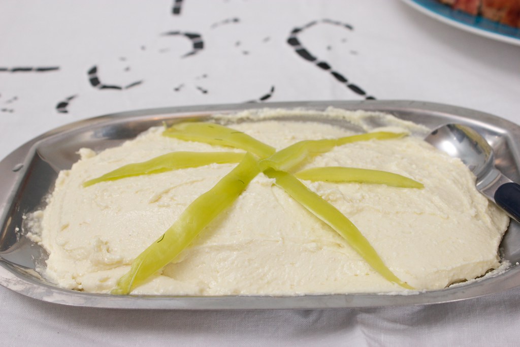 A bowl of Greek tirokafteri spicy whipped feta dip with roasted pepper