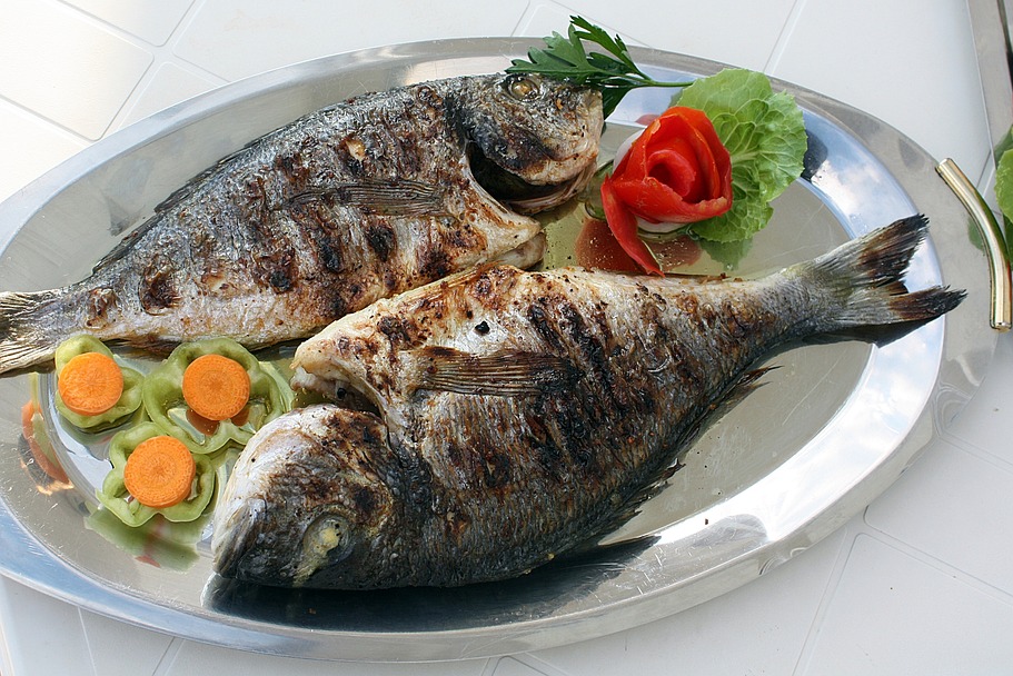 A whole baked Greek tsipoura sea bream with lemon and herbs