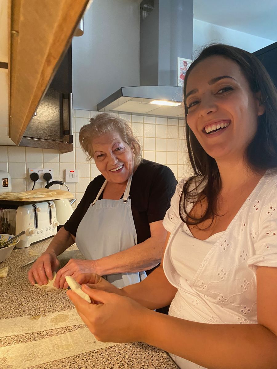 Yiayia Kalliopi and family making phyllo together in her kitchen